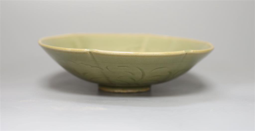 A Chinese carved celadon dish, 18.5cm diameter